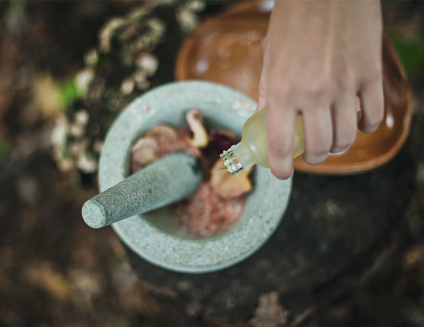 Pouring liquid into mortar and pestle