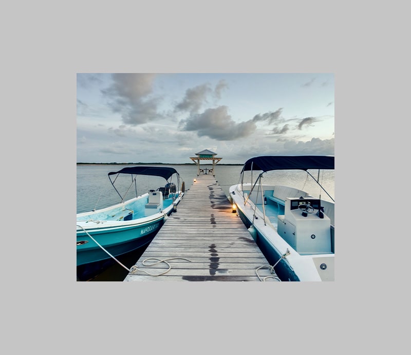 Boat shuttles for the Beach Club at Mahogany Bay Resort